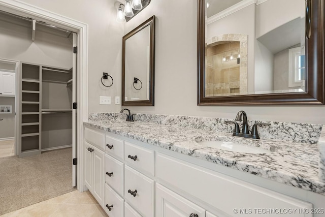 14504 E 80th St, Owasso, OK 74055 - bathroom featuring a spacious closet, a sink, double vanity, and crown molding