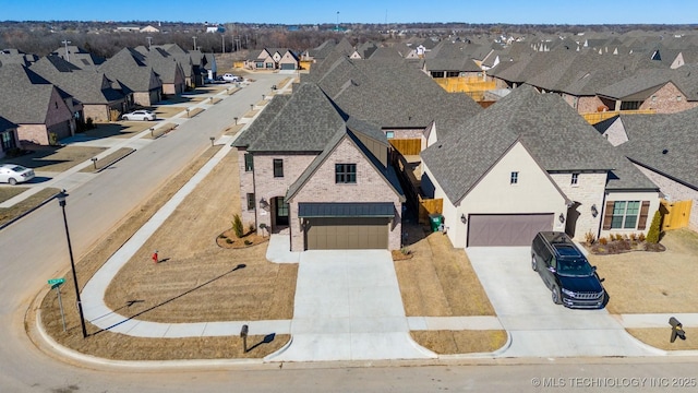 birds eye view of property with a residential view