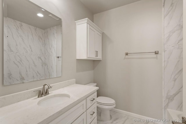 full bathroom featuring a washtub, marble finish floor, toilet, vanity, and baseboards