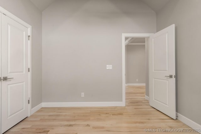 unfurnished room featuring light wood-type flooring and baseboards