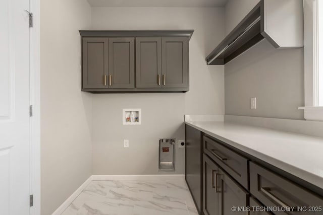 laundry area with cabinet space, baseboards, marble finish floor, hookup for an electric dryer, and washer hookup