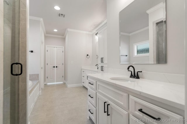 bathroom with recessed lighting, vanity, visible vents, ornamental molding, and a bath