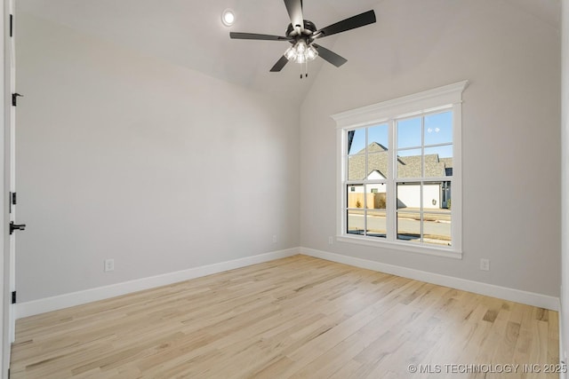 unfurnished room featuring baseboards, vaulted ceiling, light wood finished floors, and ceiling fan