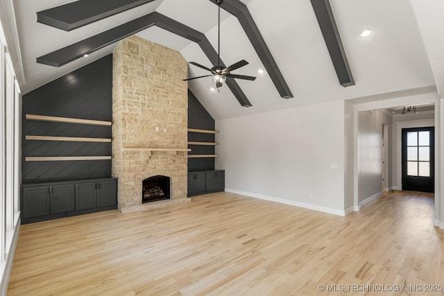 unfurnished living room featuring a fireplace, ceiling fan, high vaulted ceiling, light wood-type flooring, and baseboards