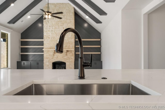 interior details with light stone counters and beam ceiling