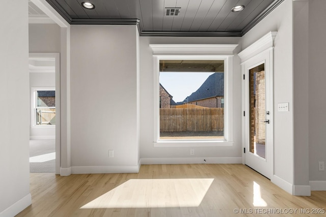 interior space featuring ornamental molding, recessed lighting, visible vents, and wood finished floors