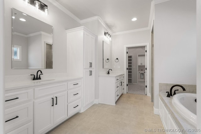 full bathroom with two vanities, crown molding, and a sink