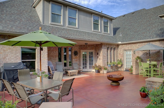 view of patio / terrace featuring grilling area and french doors