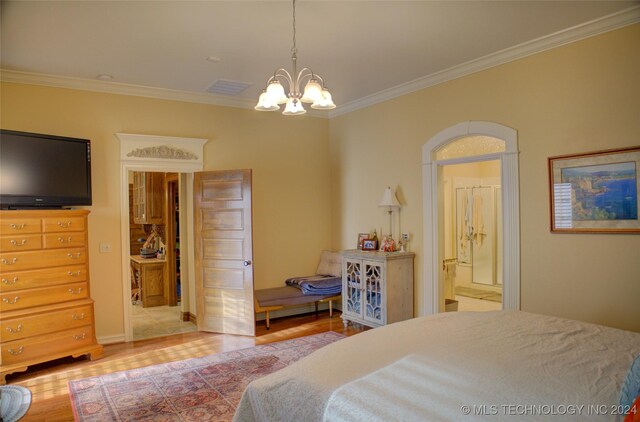 bedroom featuring crown molding, light hardwood / wood-style flooring, and a notable chandelier