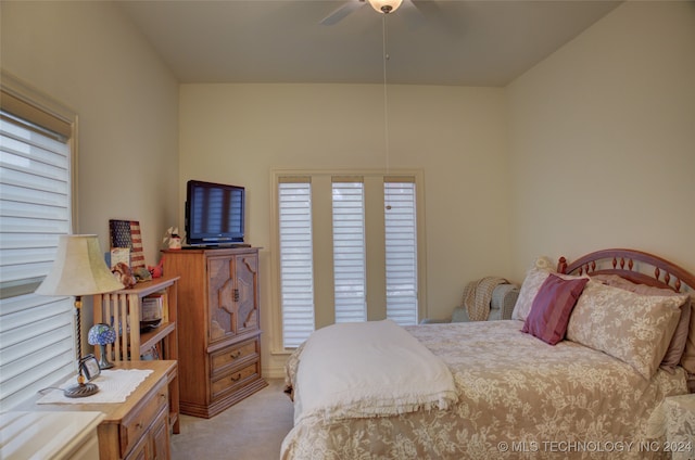 bedroom with light colored carpet and ceiling fan