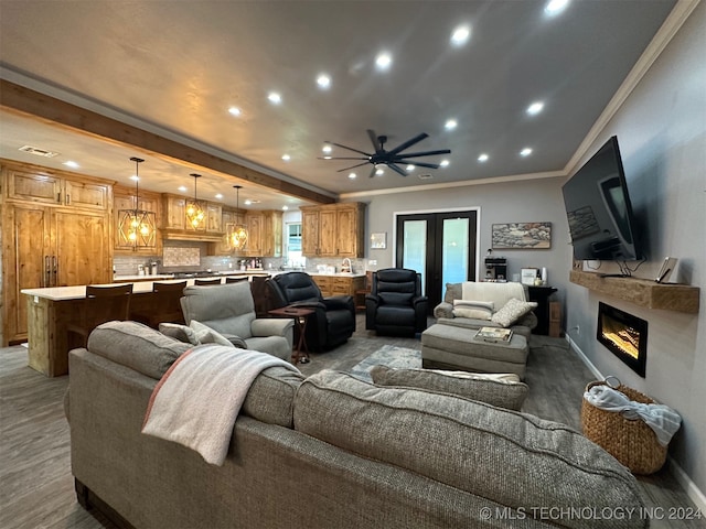 living room featuring french doors, ceiling fan, ornamental molding, and light hardwood / wood-style flooring