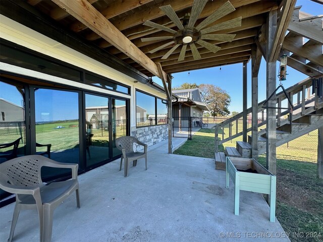 view of patio / terrace featuring ceiling fan