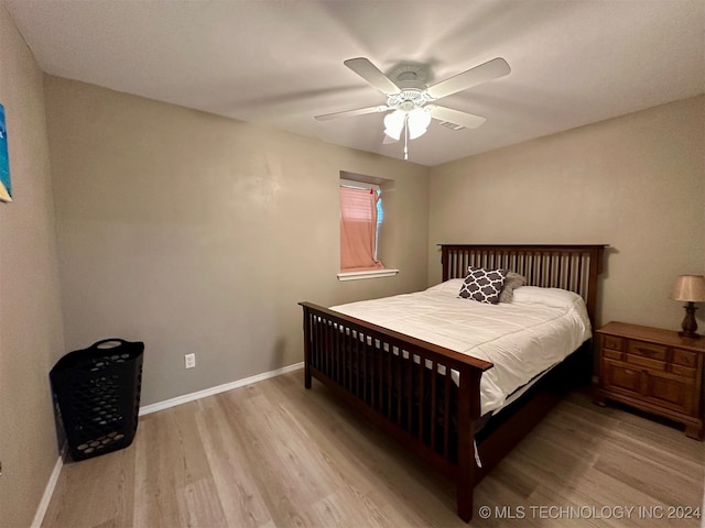 bedroom with hardwood / wood-style flooring and ceiling fan