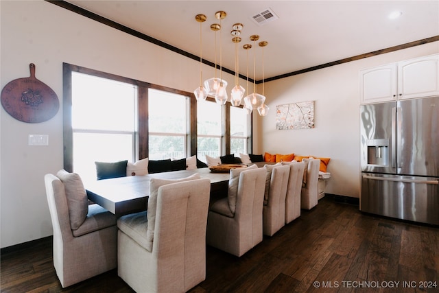 dining area featuring ornamental molding and dark wood-type flooring