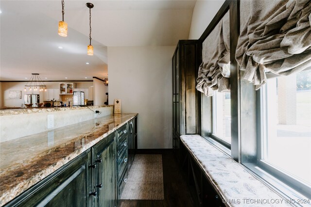 4100 N 430th Rd, Locust Grove, OK 74352 - kitchen with plenty of natural light, light stone countertops, decorative light fixtures, recessed lighting, and freestanding refrigerator