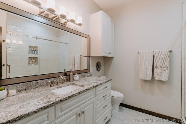 4100 N 430th Rd, Locust Grove, OK 74352 - full bathroom featuring toilet, vanity, a stall shower, and baseboards