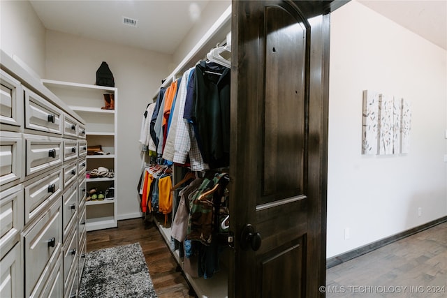 walk in closet featuring dark hardwood / wood-style flooring