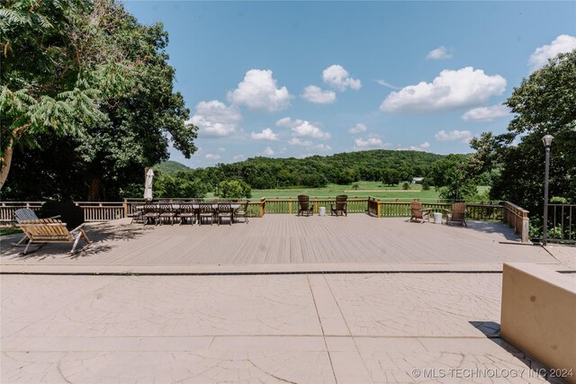 4100 N 430th Rd, Locust Grove, OK 74352 - view of patio / terrace featuring a wooden deck and a forest view