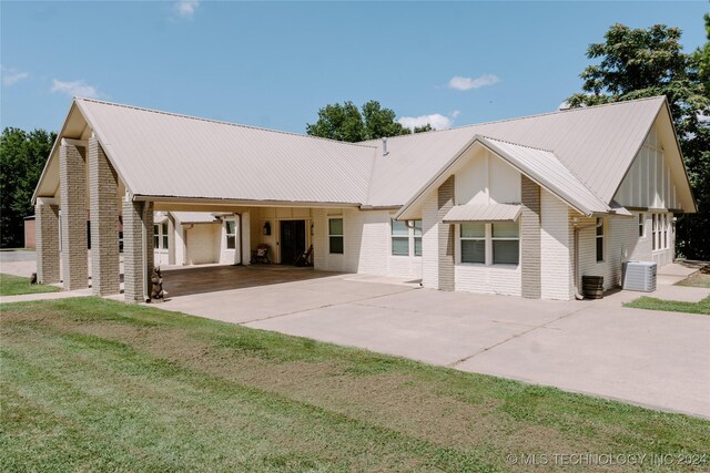 4100 N 430th Rd, Locust Grove, OK 74352 - view of front of property with concrete driveway, a carport, brick siding, and metal roof