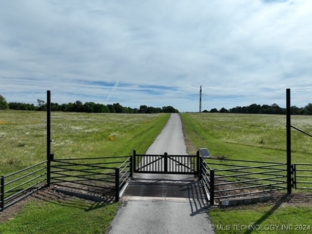 view of gate featuring a rural view