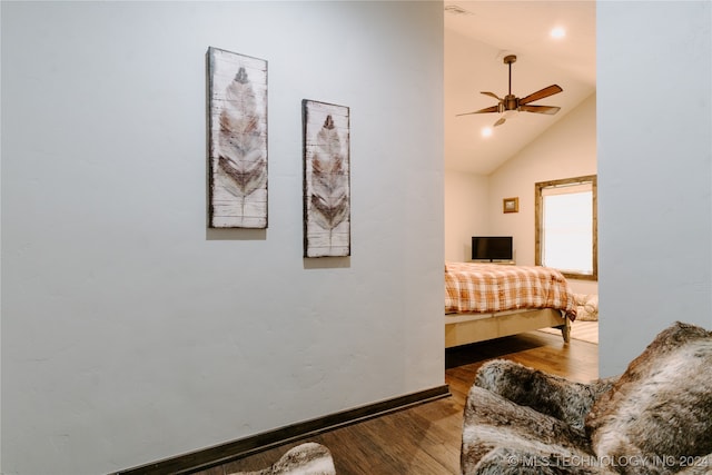 bedroom featuring ceiling fan, dark wood-type flooring, and high vaulted ceiling