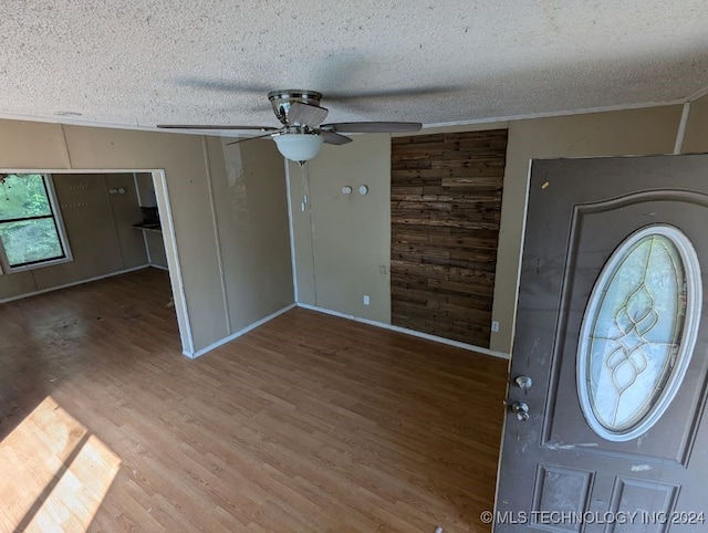 entryway featuring a textured ceiling, ceiling fan, and hardwood / wood-style floors