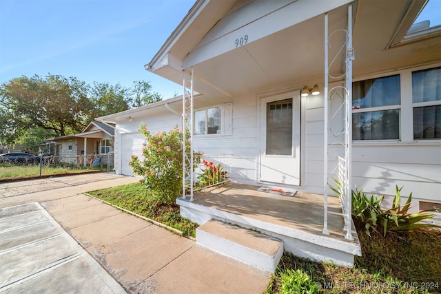 doorway to property featuring a garage