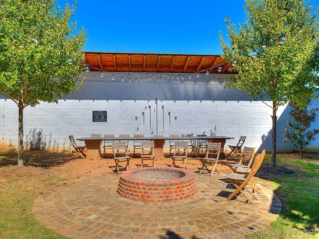 view of patio / terrace featuring a fire pit