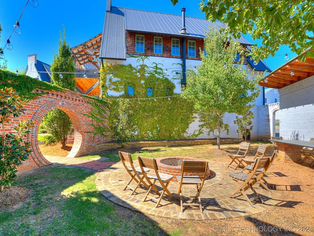 view of yard with a patio area and a fire pit