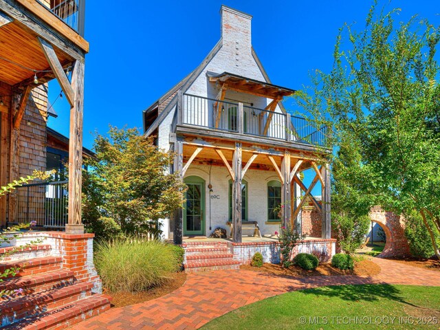 view of front facade with a porch and a balcony