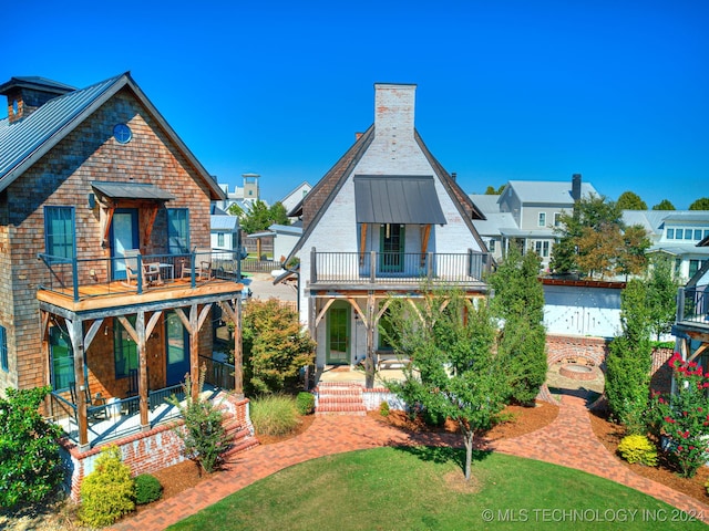 view of front of property with a balcony