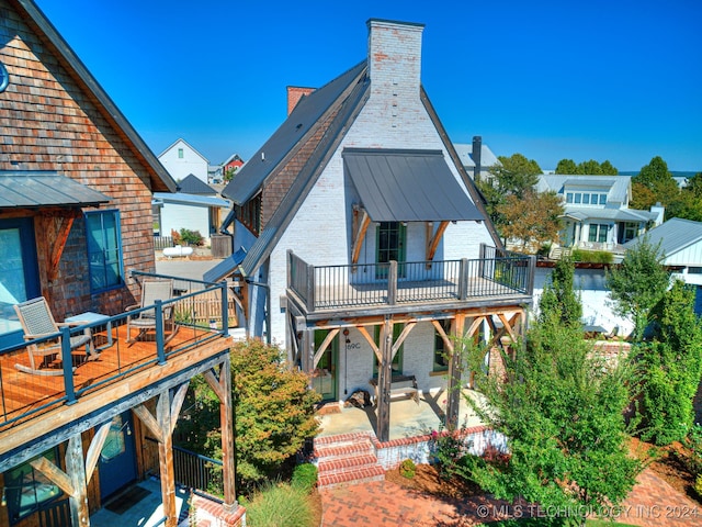 rear view of house featuring a patio area