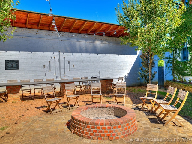 view of patio / terrace featuring a fire pit