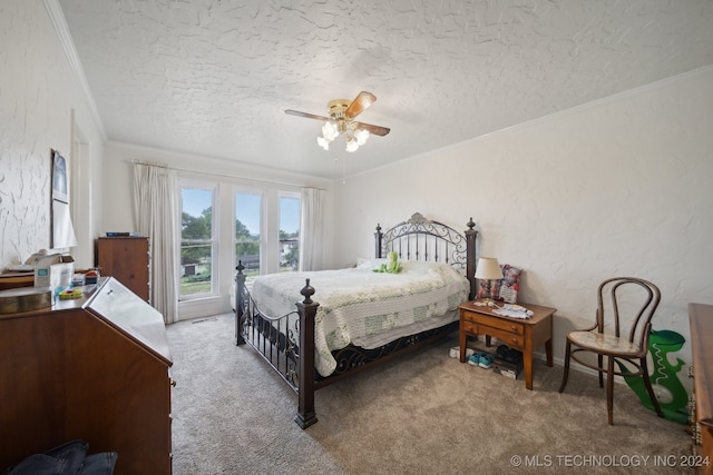 bedroom featuring ceiling fan, light colored carpet, and a textured ceiling