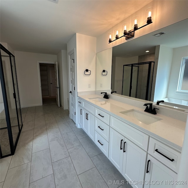 bathroom featuring vanity, separate shower and tub, and tile patterned floors