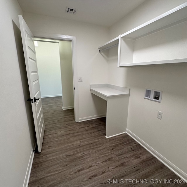 washroom with dark wood-type flooring and hookup for a washing machine