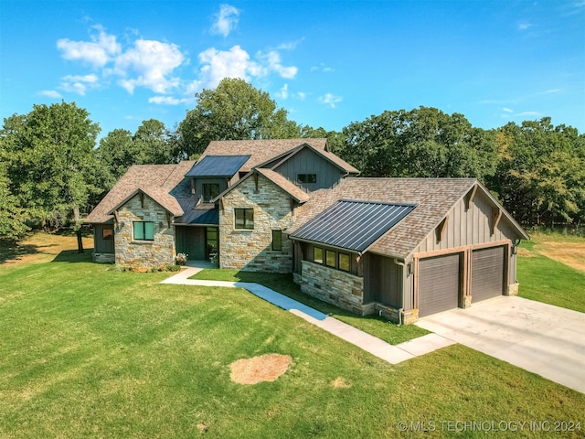 craftsman-style home featuring a garage and a front lawn