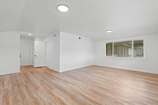 empty room with light hardwood / wood-style flooring