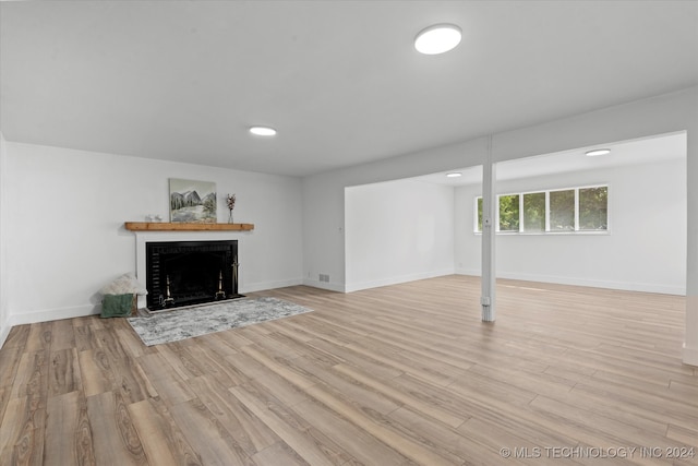 unfurnished living room featuring light wood-type flooring