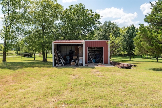 view of outbuilding featuring a lawn