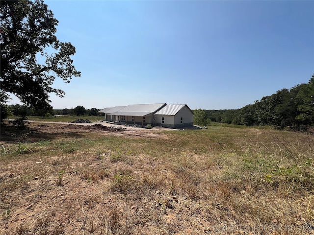 view of yard with a rural view