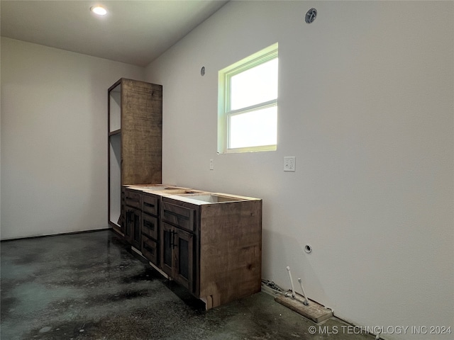 bathroom with vanity and concrete floors