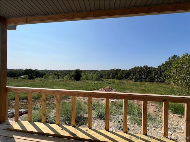 wooden terrace with a rural view