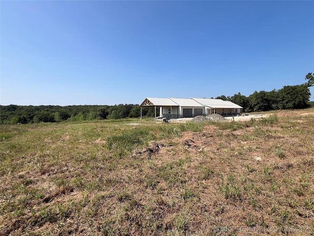 view of yard with a rural view