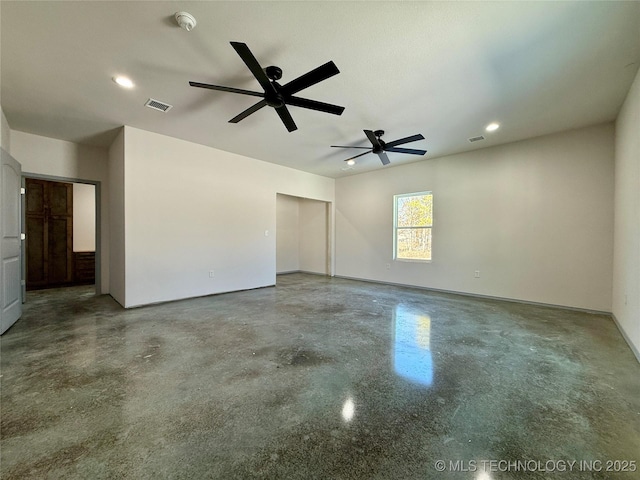 spare room featuring concrete flooring