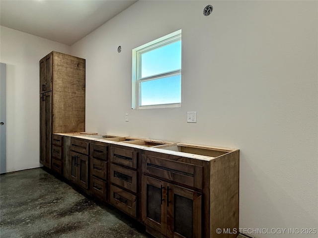 bathroom featuring concrete flooring