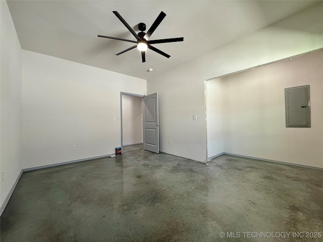 unfurnished room with electric panel, concrete flooring, and ceiling fan