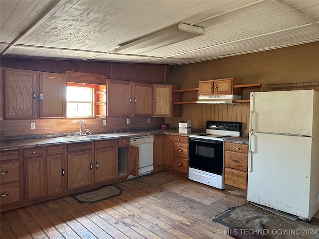 kitchen featuring light wood-type flooring, white appliances, and sink