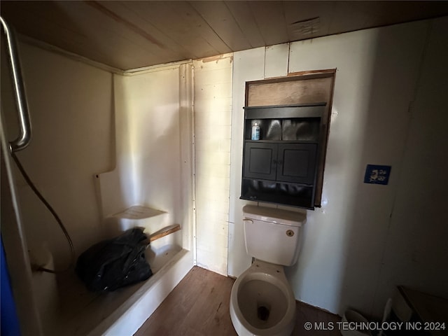 bathroom with toilet and hardwood / wood-style flooring