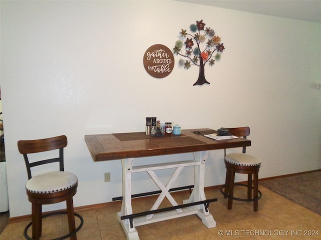 dining area featuring tile patterned floors